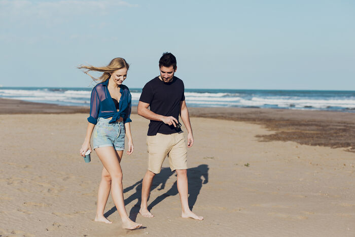 Man spending holiday with wife’s friend at beach, wife feeling suspicious as something seems off in the couple’s behavior. Man spending holiday with wife’s friend at beach, wife feeling suspicious as something seems off in the couple’s behavior.