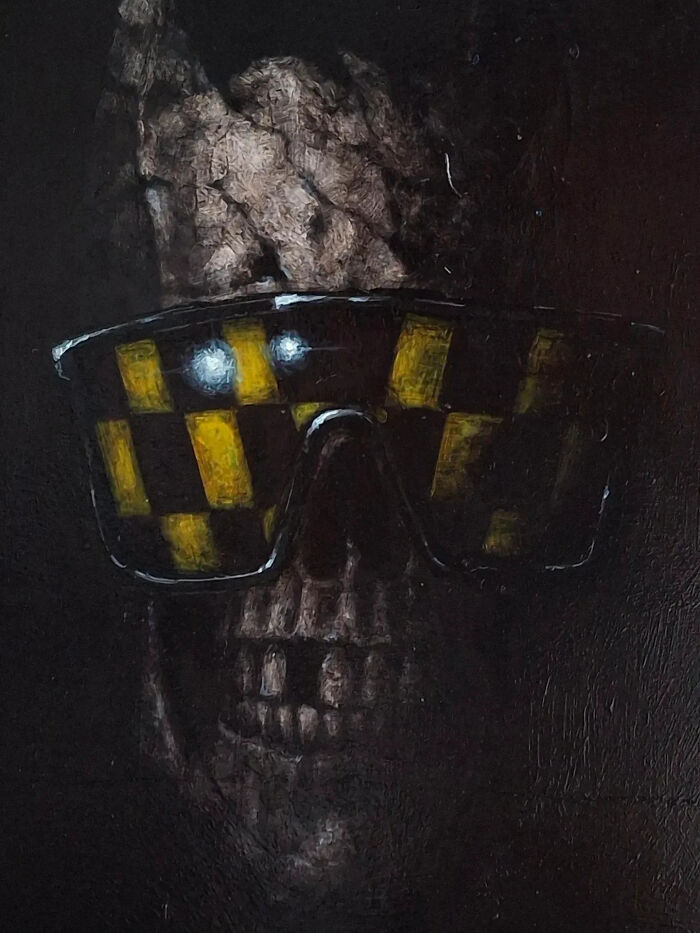 Creepy painting by Tyler Tilley featuring a dark skull wearing reflective yellow checkered sunglasses.