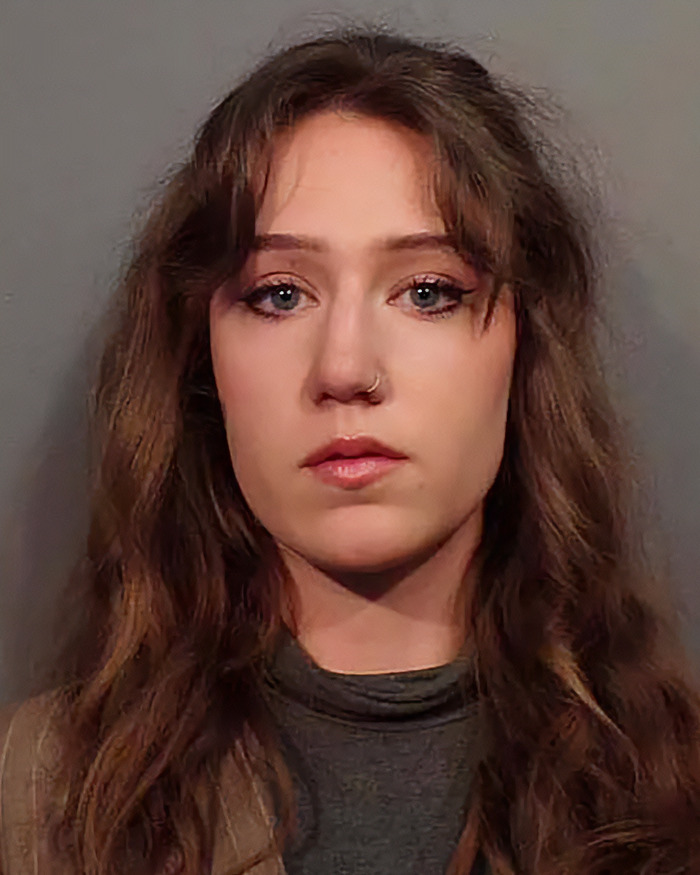 Young woman with long hair and nose ring, shown in a portrait style, linked to influencer who snatched baby wombat on camera. Young woman with long hair and nose ring, shown in a portrait style, linked to influencer who snatched baby wombat on camera.
