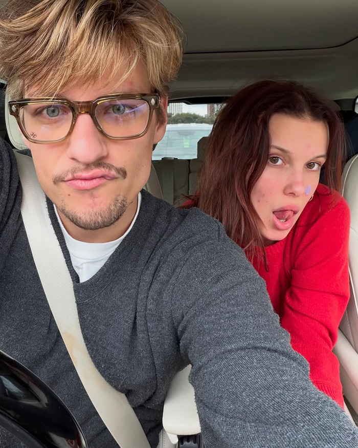 Jake Bongiovi and Millie Bobby Brown in a car, capturing a candid moment related to their baby protection incident. Jake Bongiovi and Millie Bobby Brown in a car, capturing a candid moment related to their baby protection incident.