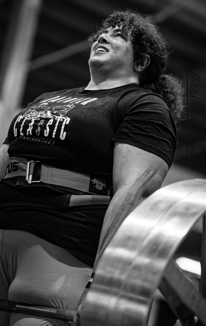 Strongwoman lifting heavy weights in a gym, showcasing power and determination in a competitive strongwoman event. Strongwoman lifting heavy weights in a gym, showcasing power and determination in a competitive strongwoman event.
