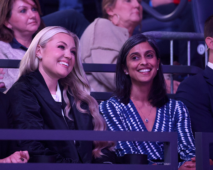 Two women smiling and sitting in an audience, relating to JD Kirk and Usha Vance split rumors discussion.