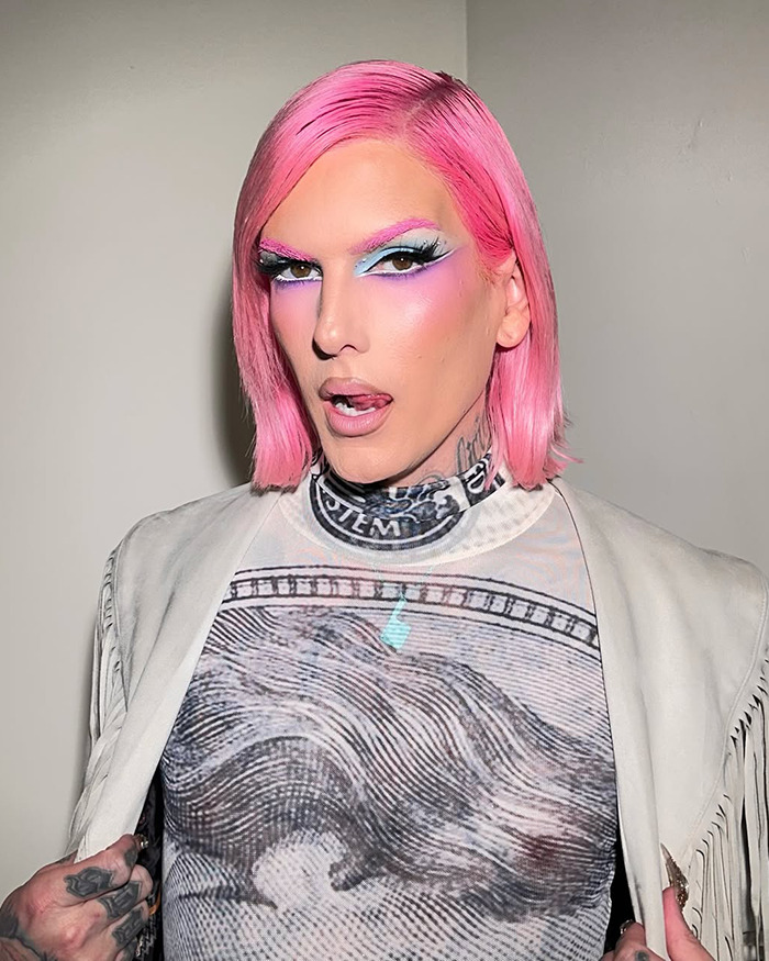 Jeffree Star with pink hair and bold makeup, posing against a plain background amid backlash over pro-trans parents comments. Jeffree Star with pink hair and bold makeup, posing against a plain background amid backlash over pro-trans parents comments.