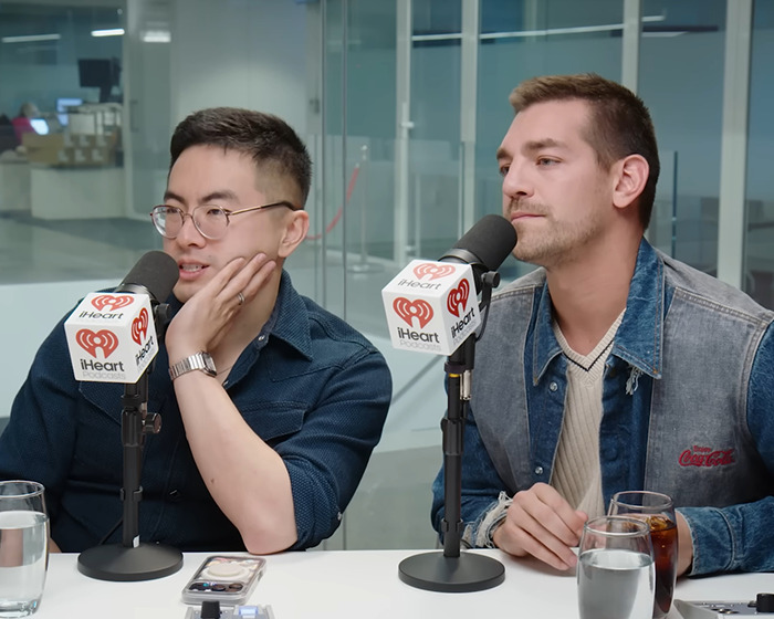 Two men speaking into iHeart podcast microphones during a discussion on male co-stars punishing Jennifer Lawrence. Two men speaking into iHeart podcast microphones during a discussion on male co-stars punishing Jennifer Lawrence.