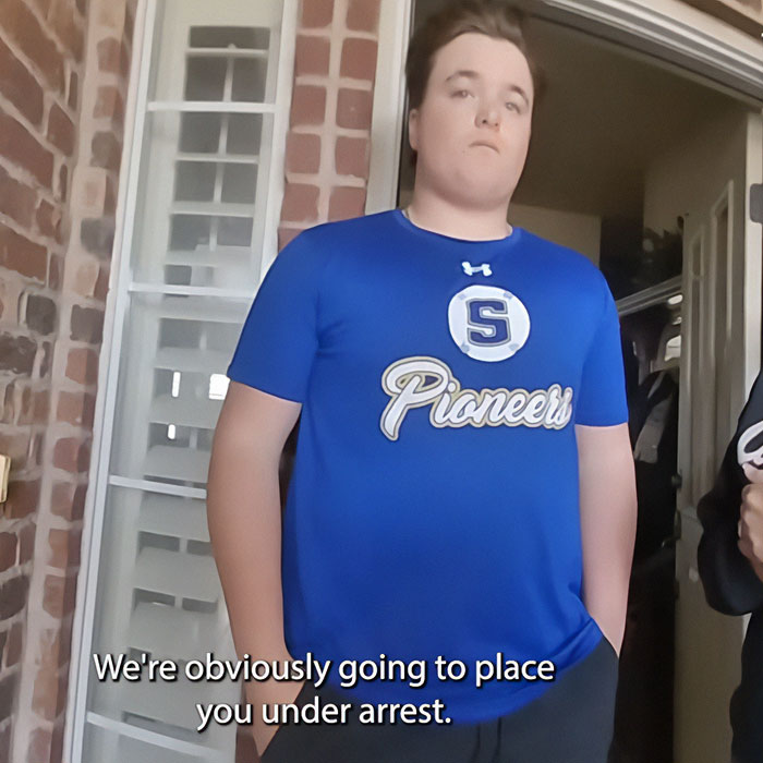 Teen in blue Pioneers shirt stands indoors with caption about arrest amid protests erupting across Oklahoma. Teen in blue Pioneers shirt stands indoors with caption about arrest amid protests erupting across Oklahoma.