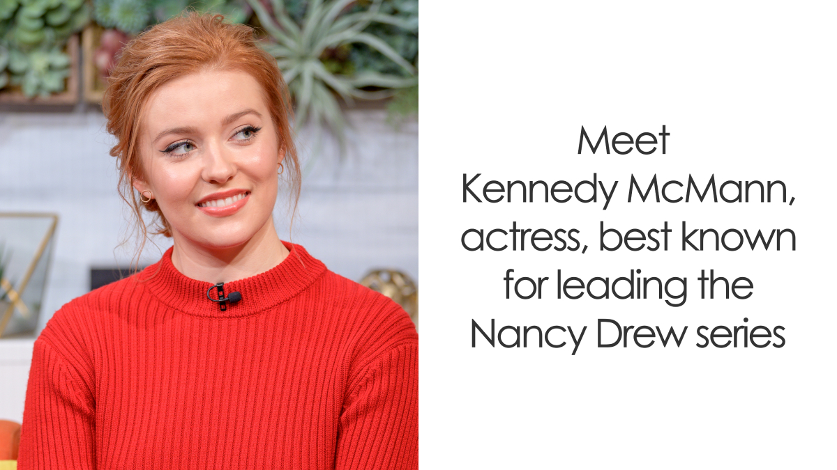 Kennedy McMann smiling in a red sweater during an interview, highlighting her acting career and roles.