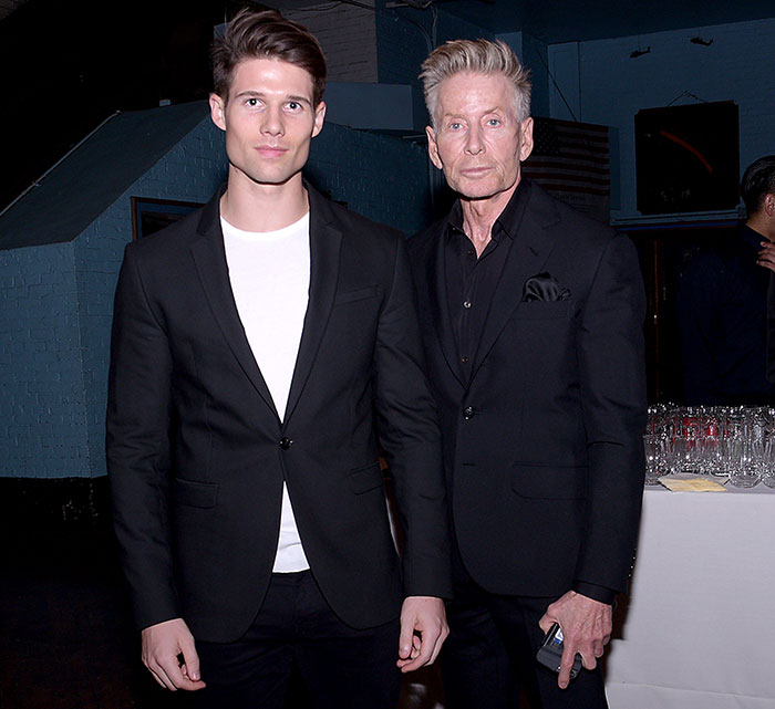 Calvin Klein, 83, and his 36-year-old boyfriend dressed in black suits at a formal indoor event. Calvin Klein, 83, and his 36-year-old boyfriend dressed in black suits at a formal indoor event.
