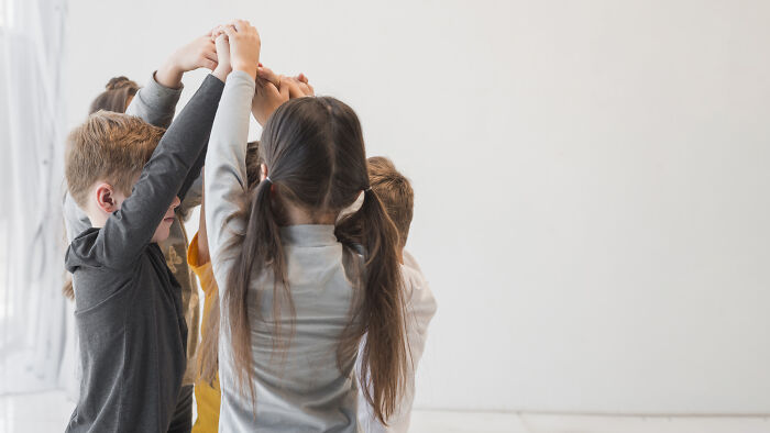 A group of children playing together, symbolizing relationships and connections after years apart. A group of children playing together, symbolizing relationships and connections after years apart.