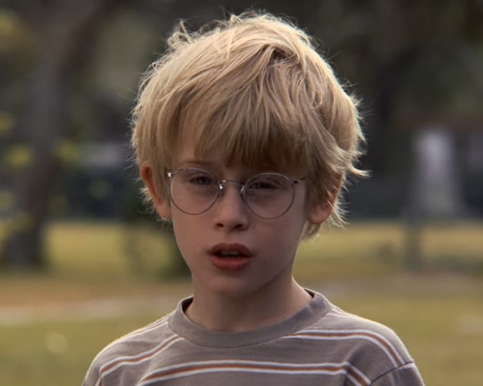 Young boy wearing glasses in an outdoor scene from My Girl recalling the tragic filming experience revealed by Macaulay Culkin. Young boy wearing glasses in an outdoor scene from My Girl recalling the tragic filming experience revealed by Macaulay Culkin.