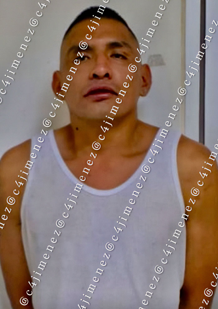 Man in white tank top, representing reality for a lot of women in Mexico involving the Mexican president situation. Man in white tank top, representing reality for a lot of women in Mexico involving the Mexican president situation.