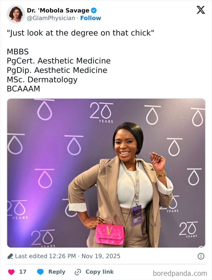 Woman celebrates academic success wearing beige suit and pink purse as internet roasts man bashing her PhD achievements. Woman celebrates academic success wearing beige suit and pink purse as internet roasts man bashing her PhD achievements.
