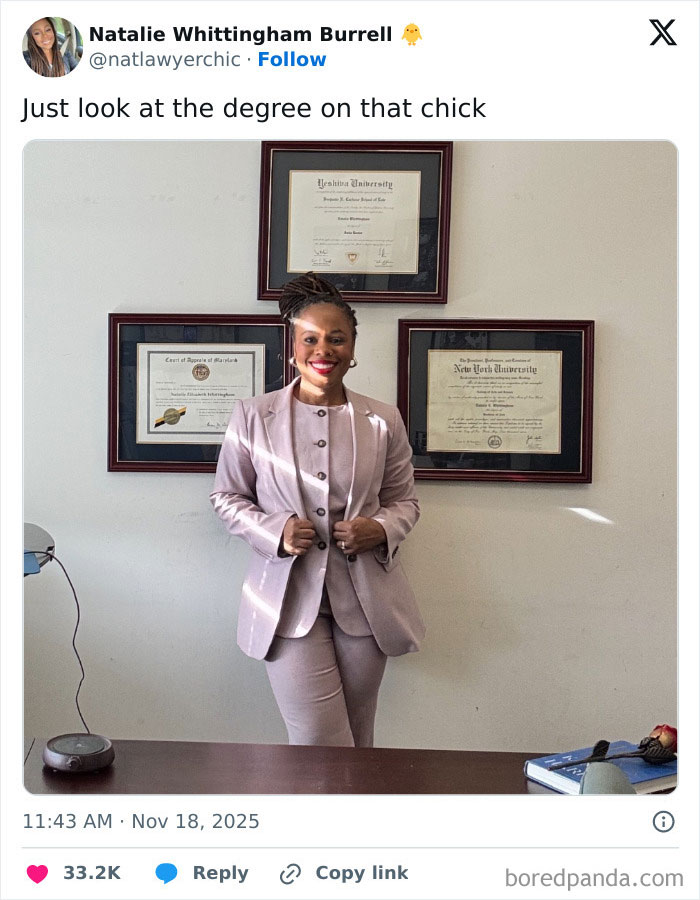 Woman in a professional suit smiling confidently with multiple framed academic degrees celebrating women’s success. Woman in a professional suit smiling confidently with multiple framed academic degrees celebrating women’s success.