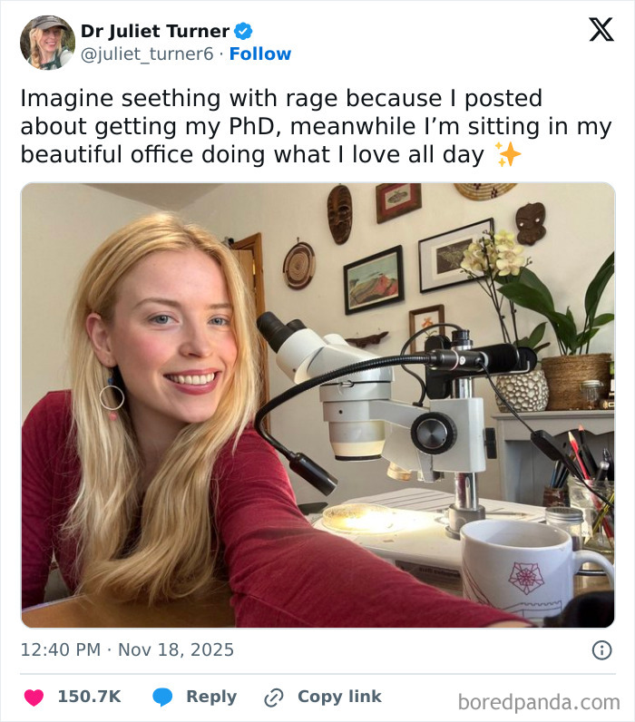 Woman with PhD smiling in her office beside a microscope, celebrating women’s success in science and research. Woman with PhD smiling in her office beside a microscope, celebrating women’s success in science and research.