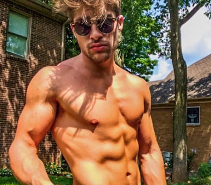 Shirtless muscular young man wearing sunglasses outdoors, resembling viral sensation dubbed the next Brad Pitt. Shirtless muscular young man wearing sunglasses outdoors, resembling viral sensation dubbed the next Brad Pitt.