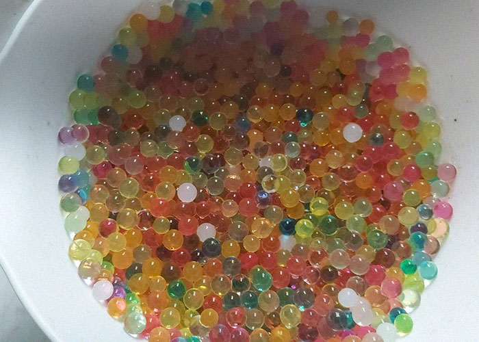 Colorful water beads spread in a bowl, illustrating dangers in everyday life shared by a medical malpractice lawyer.