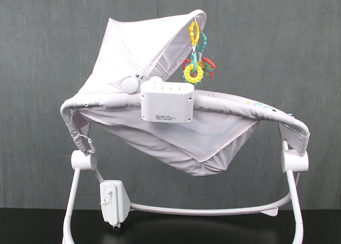 Baby cradle with hanging toys, highlighting medical malpractice lawyer insights on dangerous things in everyday life.