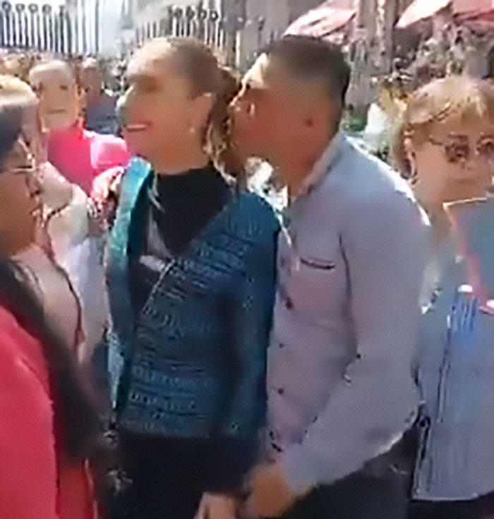Man kisses and fondles Mexican president while she speaks to crowd, highlighting reality for many women in public settings. Man kisses and fondles Mexican president while she speaks to crowd, highlighting reality for many women in public settings.