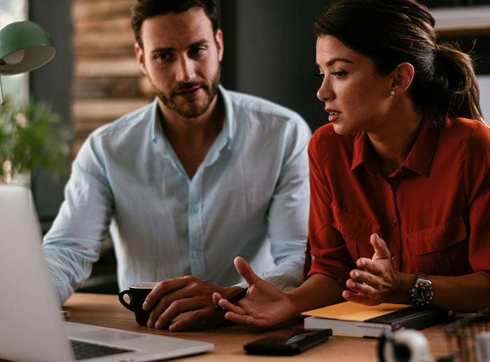 Bride and groom discussing secret wedding invites sent by mother-in-law to protect family image. Bride and groom discussing secret wedding invites sent by mother-in-law to protect family image.