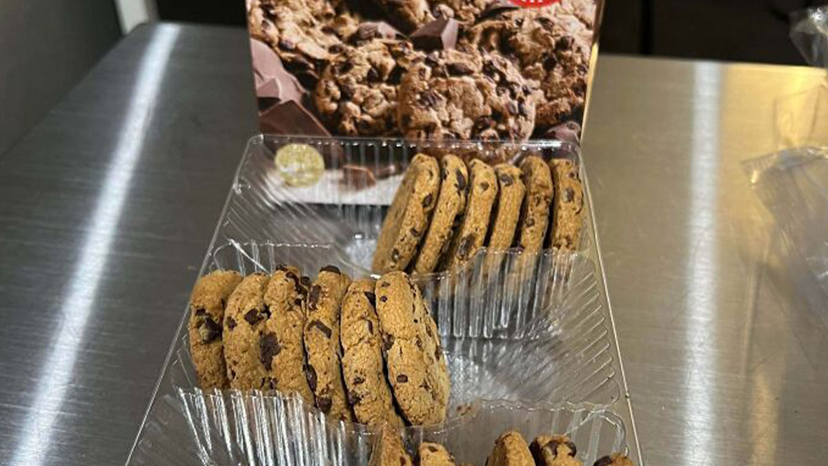 Package of cookies with misleading packaging showing fewer cookies than the image on the box suggests