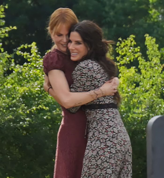 Nicole Kidman hugging a woman outdoors, related to divorce update and criticism about being married to a Stepford wife. Nicole Kidman hugging a woman outdoors, related to divorce update and criticism about being married to a Stepford wife.