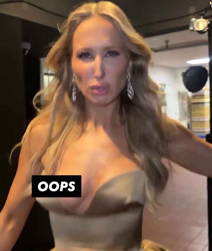 Female celebrity in a glamorous dress with an oops moment, illustrating celebrities revealing more than they should in 2025.