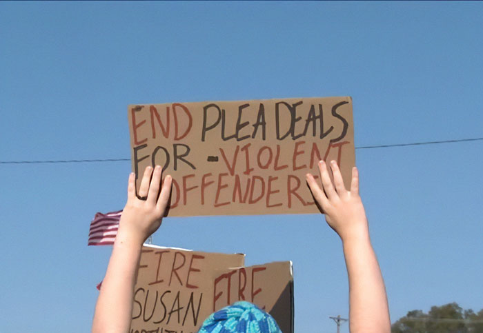 Protests erupt in Oklahoma with demonstrators holding signs against plea deals for violent offenders. Protests erupt in Oklahoma with demonstrators holding signs against plea deals for violent offenders.