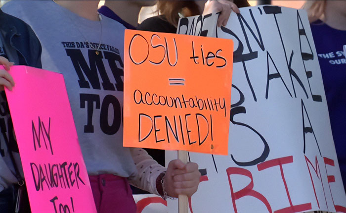 Protests erupt across Oklahoma as crowd holds signs demanding accountability for OSU amid outrage over case. Protests erupt across Oklahoma as crowd holds signs demanding accountability for OSU amid outrage over case.