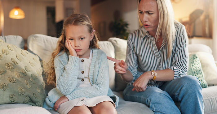 Woman looking stressed on couch while child appears upset, illustrating daily screaming and meltdowns toll on family life. Woman looking stressed on couch while child appears upset, illustrating daily screaming and meltdowns toll on family life.