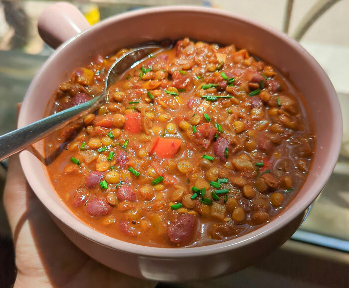 Bowl of hearty lentil and bean stew garnished with fresh herbs, showcasing kitchen tips and tricks for cooking skills. Bowl of hearty lentil and bean stew garnished with fresh herbs, showcasing kitchen tips and tricks for cooking skills.