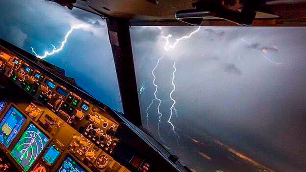 View from a pilot cockpit showing lightning strikes during a terrifying situation handled with calm and focus in the cockpit.