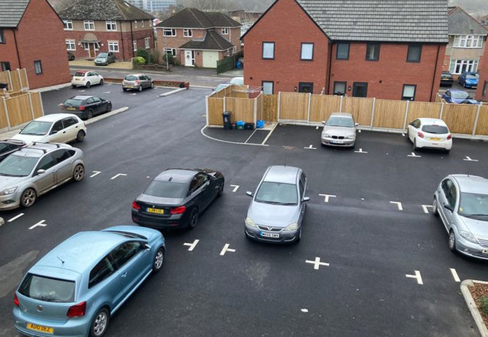 Cars parked incorrectly in a lot with confusing design and architecture flaws showing poor common sense in layout.