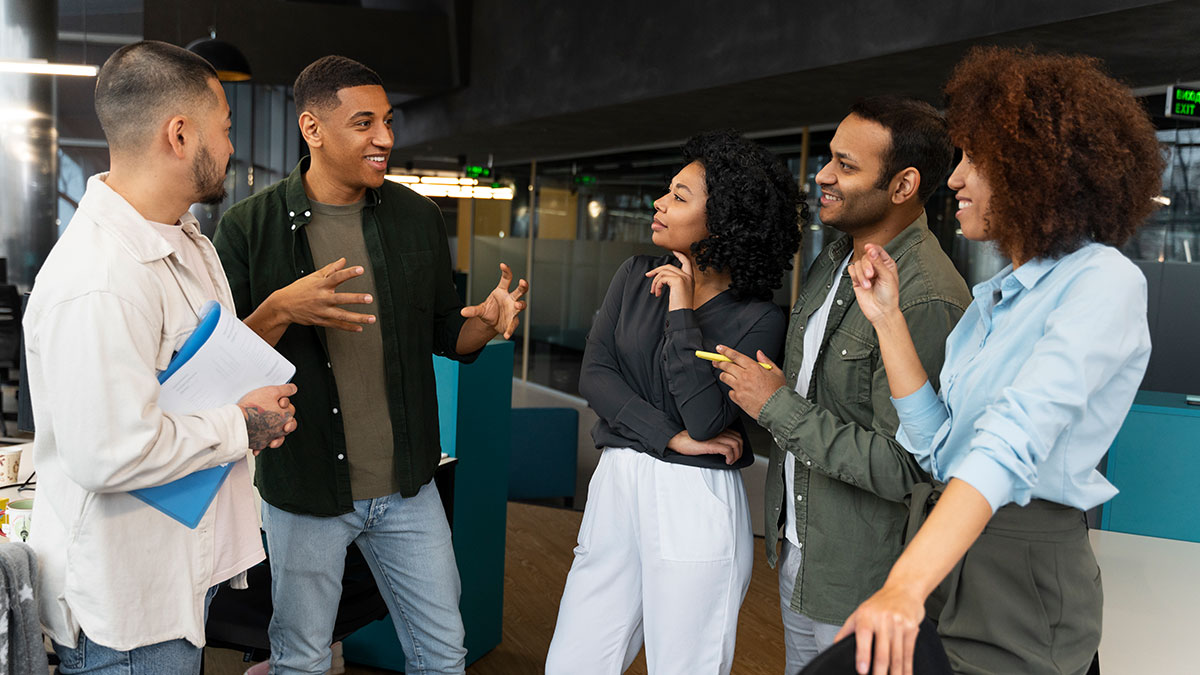 A diverse group of people engaging in a lively discussion using psychological tricks to influence and connect effectively.