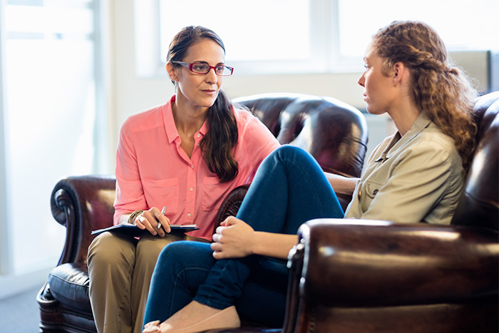 Therapist attentively listening to a patient during a session, illustrating the hidden test therapists use to judge clients.