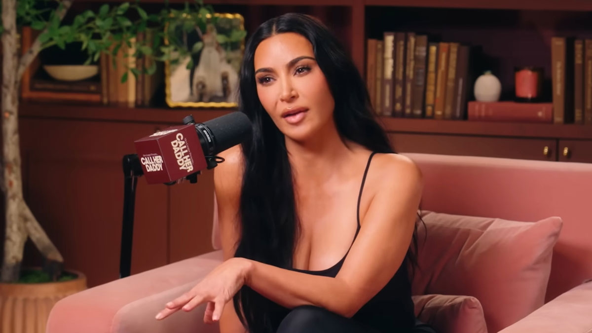 Woman speaking into a microphone during a podcast, discussing real life examples of the butterfly effect in everyday situations.