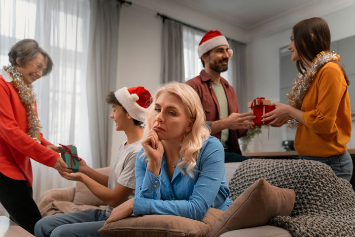 Young woman looks unprepared for wild family Christmas with screaming matches and alcohol-fueled fights around her. Young woman looks unprepared for wild family Christmas with screaming matches and alcohol-fueled fights around her.
