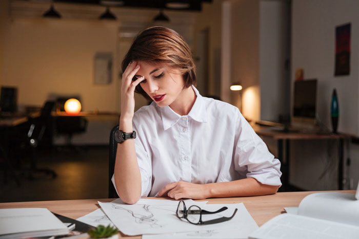 Stressed employee refusing to train replacement without pay after layoff, facing boss threatening negative reference.