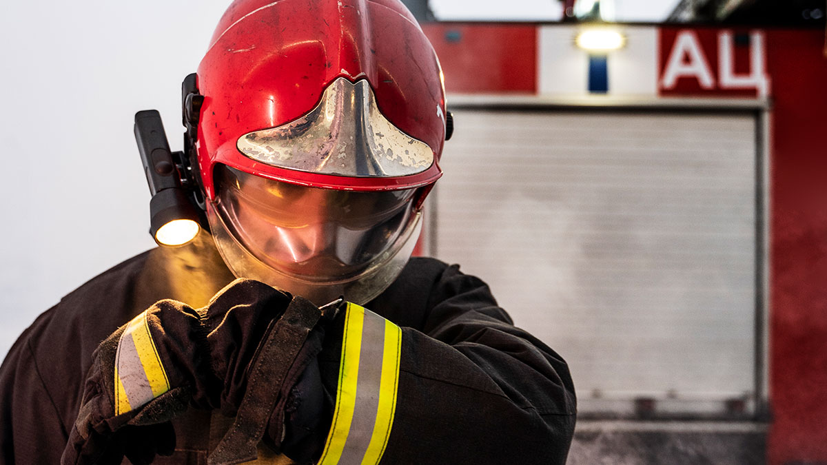 Firefighter in protective gear preparing for action, illustrating consequences when peopleu2019s lies get out of hand.