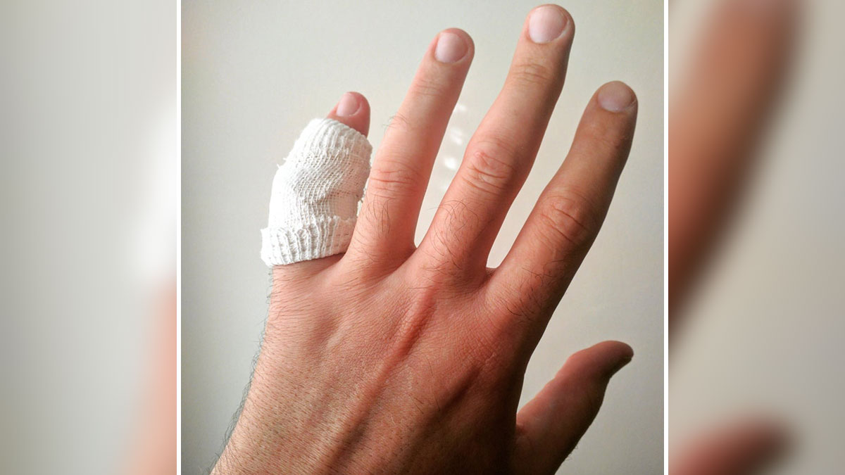 Hand with a bandaged finger showing a common injury that could lead to ridiculous reasons for ending up in the emergency room