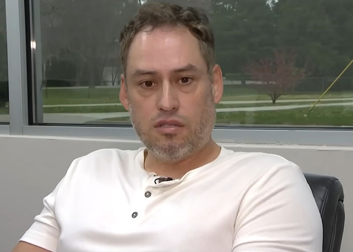 Man speaking in an indoor interview setting revealing Campbell's executive disturbing comments about soup ingredients. Man speaking in an indoor interview setting revealing Campbell's executive disturbing comments about soup ingredients.