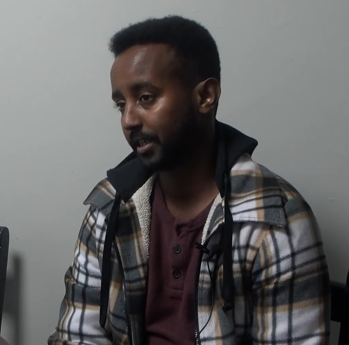 Man in plaid jacket speaking during interview about viral mom who called autistic boy the N-word in playground clash trial Man in plaid jacket speaking during interview about viral mom who called autistic boy the N-word in playground clash trial