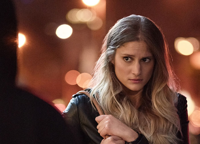 Young woman looking suspicious and uneasy during a nighttime conversation, reflecting fiance detective concerns about a suspicious partner. Young woman looking suspicious and uneasy during a nighttime conversation, reflecting fiance detective concerns about a suspicious partner.