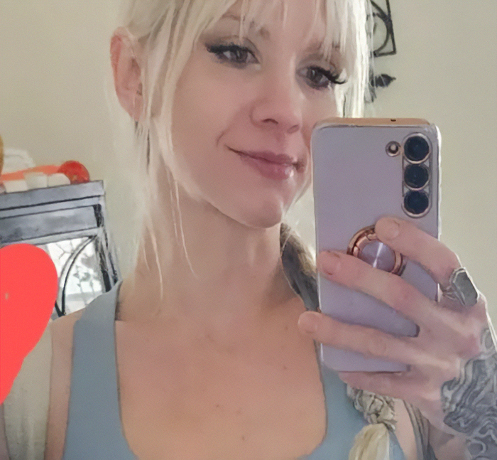 Young woman taking a selfie with smartphone, linked to viral mom who called autistic boy the n-word facing trial. Young woman taking a selfie with smartphone, linked to viral mom who called autistic boy the n-word facing trial.