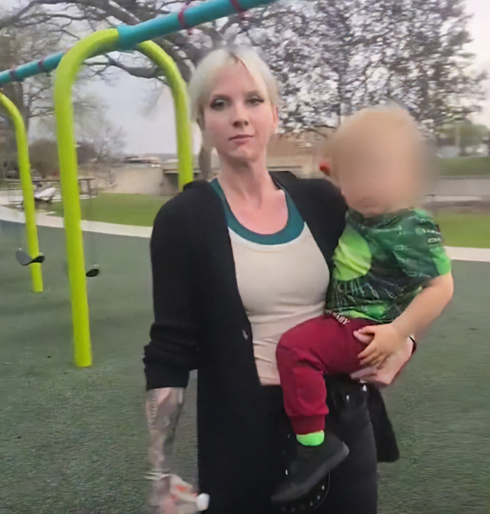 Woman holding child at playground linked to viral mom who called autistic boy the n-word in disturbing clash trial Woman holding child at playground linked to viral mom who called autistic boy the n-word in disturbing clash trial