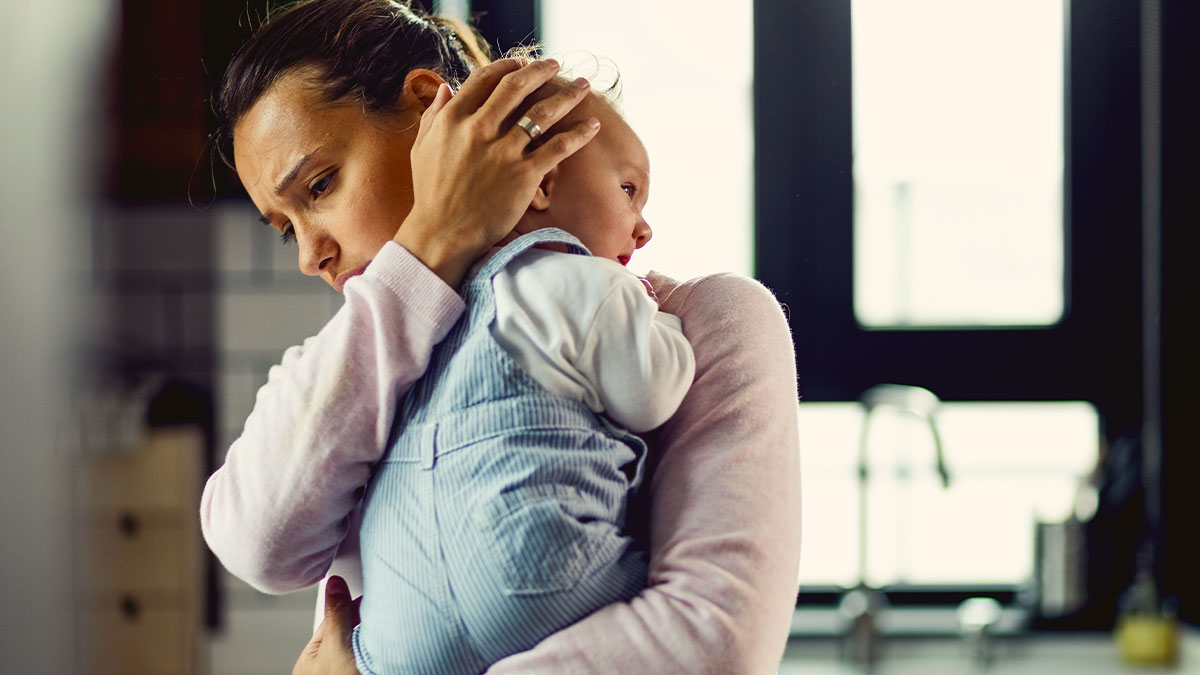 Woman holding newborn baby, looking worried and dramatic over a family dispute about babysitting and trust issues.