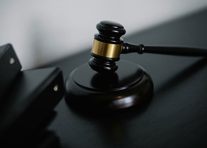 Gavel resting on a judge’s bench symbolizing court ruling in HOA president legal dispute. Gavel resting on a judge’s bench symbolizing court ruling in HOA president legal dispute.