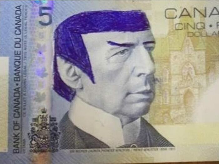 Canadian five-dollar bill with a doodle transforming the portrait into a strange character, highlighting odd facts about our world.