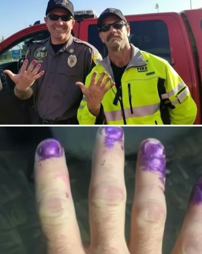 Two emergency responders showing stained fingers with purple ink, illustrating strange facts from our world.