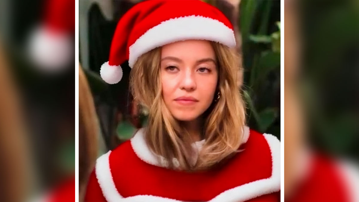 Sydney Sweeney wearing a red and white Santa outfit with a festive hat in a holiday-themed setting.