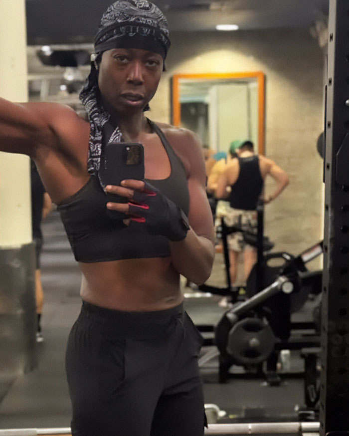 Trans woman in gym attire takes a mirror selfie at Gold's Gym amid backlash following confrontation with lesbian user. Trans woman in gym attire takes a mirror selfie at Gold's Gym amid backlash following confrontation with lesbian user.