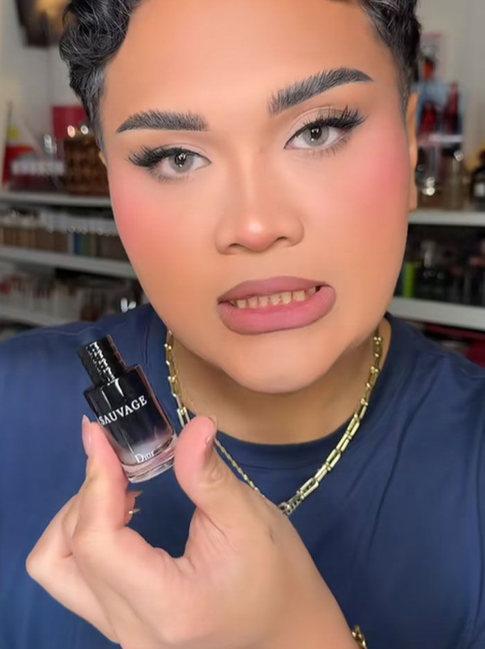 Person holding a Dior Sauvage perfume bottle, reacting to the luxury advent calendar priced at 1,000 dollars. Person holding a Dior Sauvage perfume bottle, reacting to the luxury advent calendar priced at 1,000 dollars.